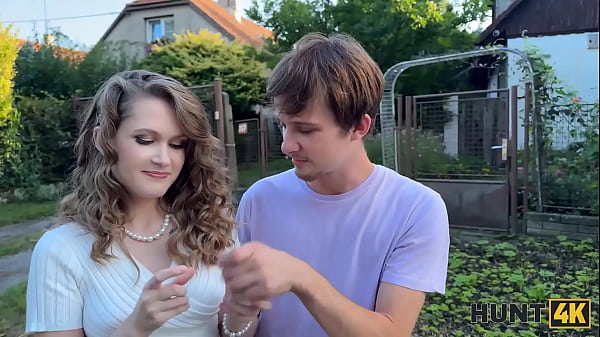 Image HUNT4K. Naughty girl is showing her natural tits on the street and cheating on her BF
