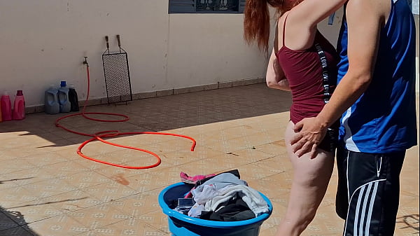 Image Redhead fucked in the backyard while hanging clothes on the clothesline