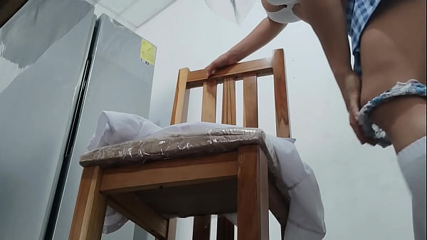 Image A female student in a short skirt starts a strange and sexual game. She's in her chair at home, masturbating her vaginal hole with a dildo. She enjoys it like a whore.
