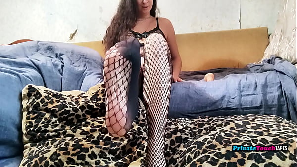 Image Sexy Russian brunette in black fishnet lingerie solo fucked with creamy dildo