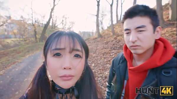 Image HUNT4K. Kawaii Japanese tourist with big boobs is sucking stranger's dick in the corner