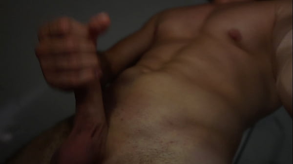 Image A muscular guy shows his dick in the shower