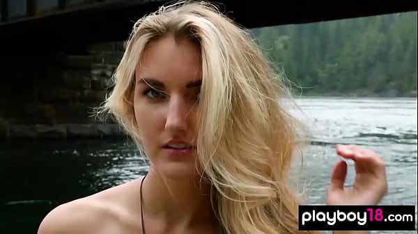 Image Blonde naked Canadian musician Anna Katarina playing on her guitar outdoor