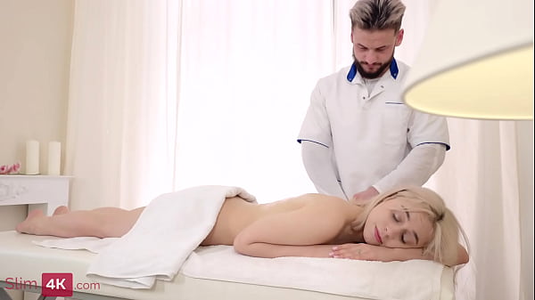 Image Light haired skinny beauty is having fun with her masseur