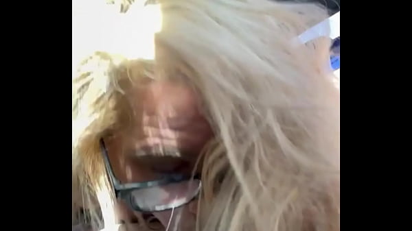 Image Real hooker wearing glasses gets on her knees in public to take a load of cum in her mouth after sucking off an old man for money