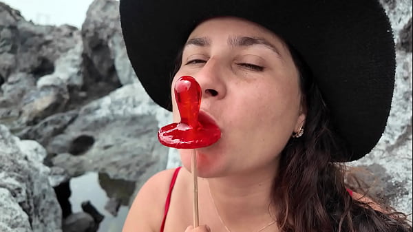Image A StepMom practices sucking on a candy on the beach. Then tests her skills on her StepSon's Dick..