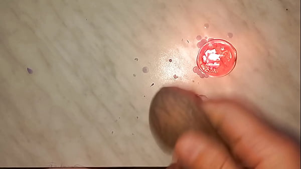 Image I drip wax onto my long tattooed foreskin, which makes me aroused and my penis gets hard.