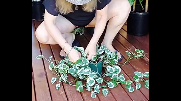 Image Maturemons,  maintaining her plants without her pants