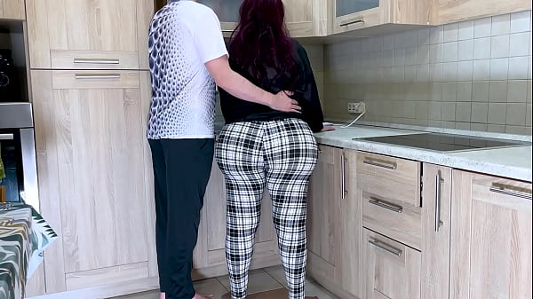 Image A big and gentle stepmom took care of her stepson when he asked her