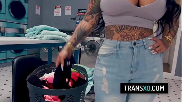 Image Busty latina shemale fucks two girls at the local laundromat