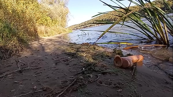Image Anal play with a big dildo by the river. Part 3