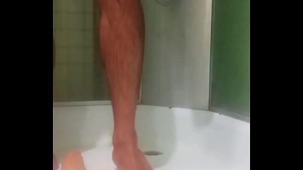 Image Anal games with a long dildo in the shower