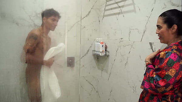 Image Big-assed stepmom ends up fucking her skinny stepson after spying on him in the shower