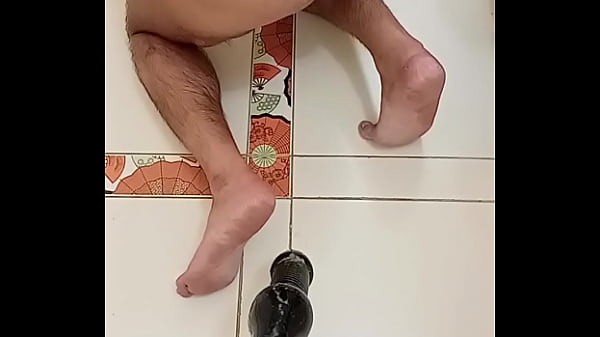 Image Mulatto pulls his ass on a big dildo in a doggy pose