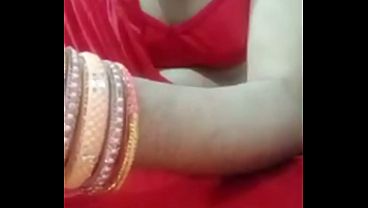 Image Indian Gay Crossdresser Bottom Gaurisissy pressing and playing with her big boobs in red saree with heavy jwellery