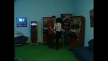 Image first he slams her on the pinball machine then he fucks her on the couch