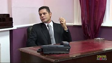 Image A beautiful blonde milf secretary is fucked hard by her horny boss on his office desk