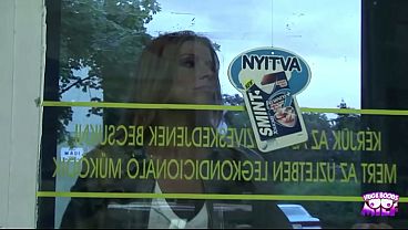 Image A horny blonde in jeans pays for groceries in the supermarket with a blowjob