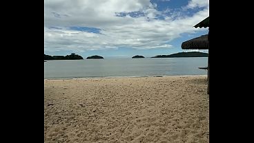 Image Sexo a tr&ecirc_s na praia - ele tirou o biquini de ladinho e meteu o rola bem gostoso nela.