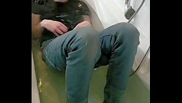Image Playing with cock and ass in wet jeans and sneakers