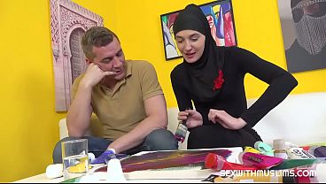 Image Sexy babe in hijab swapps a brush for a dick