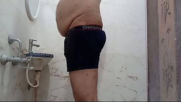 Image Undressing himself and taking shower nude in the evening