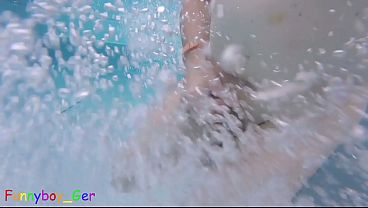 Image Naked, I explore an outdoor thermal pool and play underwater with my shaved penis.