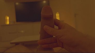 Image Massage of a large penis in front of a large TV