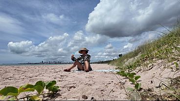 Image Milf flashing hairy pussy on public beach