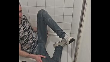 Image Playing in shower fully clothed with jeans and sneakers