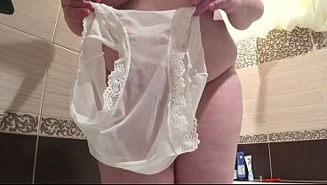 Image Hairy pussy wants to pee on you through white panties. Close-up of a mature cunt urinating. PAWG.