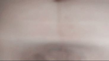 Image I masturbate on the beach while watching my beautiful stepmother lying on the bed.