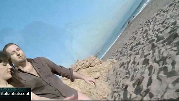 Image Very attractive brunette girl fucking on the beach with a hot male