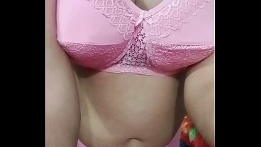 Image Indian Gay Crossdresser Gaurisissy showing and playing with her big boobs in pink honeymoon lingerie