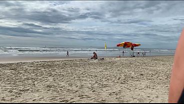 Image A milf jerk off a stranger on a public beach for a bet!