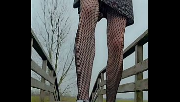 Image Annemieke in public on bridge riding dildo