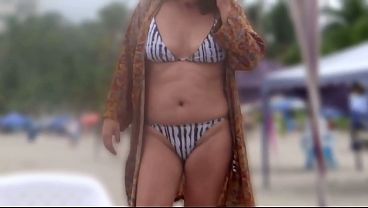 Image My stepson films me on the beach putting on a bikini, showing off, and even masturbating.