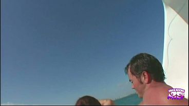 Image A redhead stunner with big fake tits is fucking wildly outdoors and takes a facial.