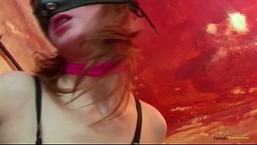 Image The mistress wears latex and commands her pet stud to lock her