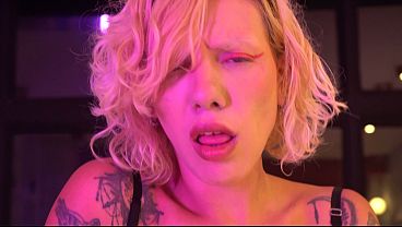 Image Busty blonde gives a blowjob and handjob backstage